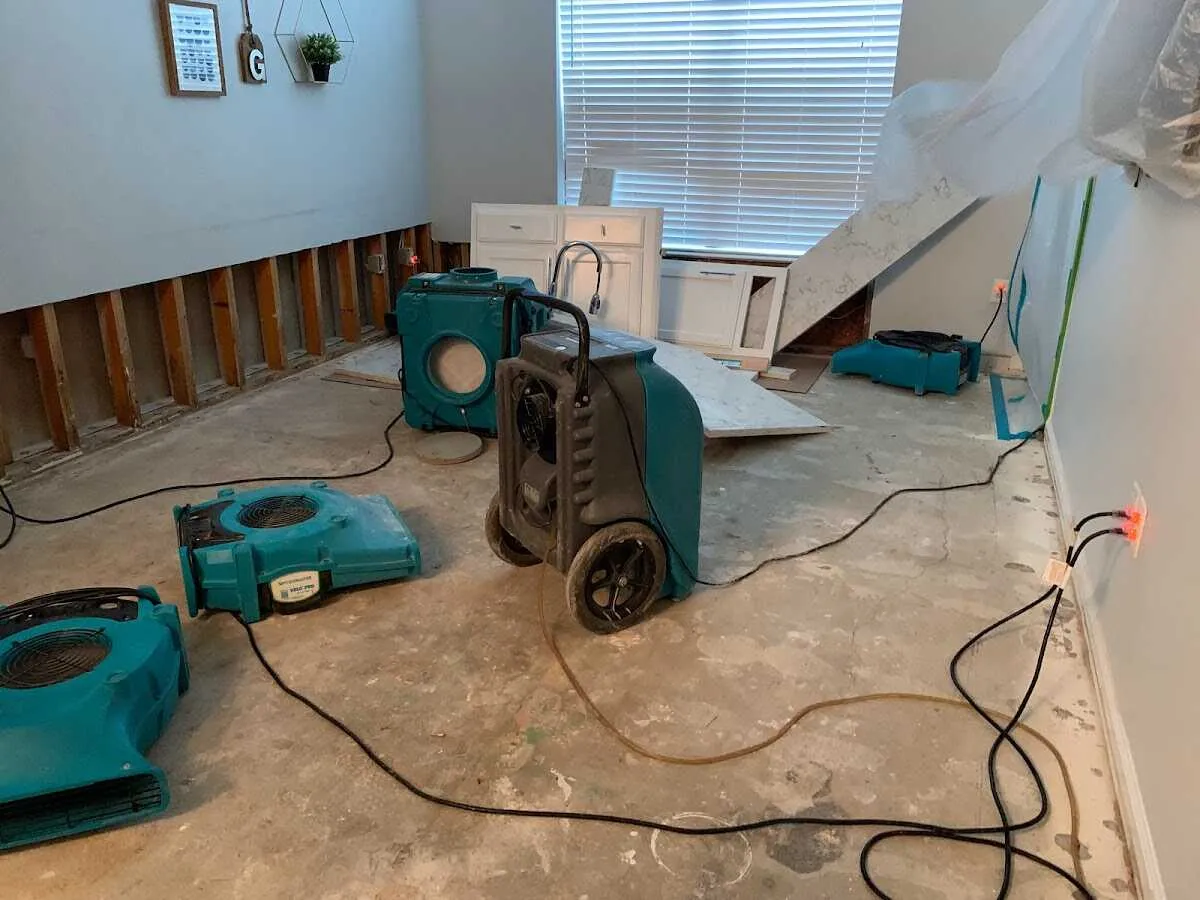 Dehumidifier in flood-cut room for Water Damage Restoration in Canton